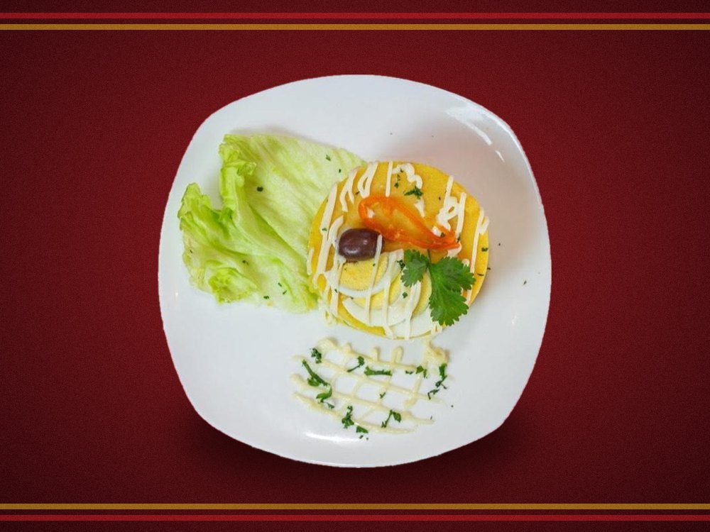 Cold chicken causa layered with avocado