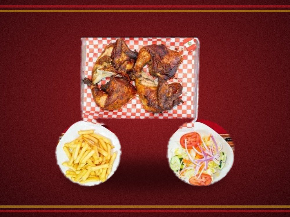 Whole Peruvian rotisserie chicken with fries and salad at Inka Brasas